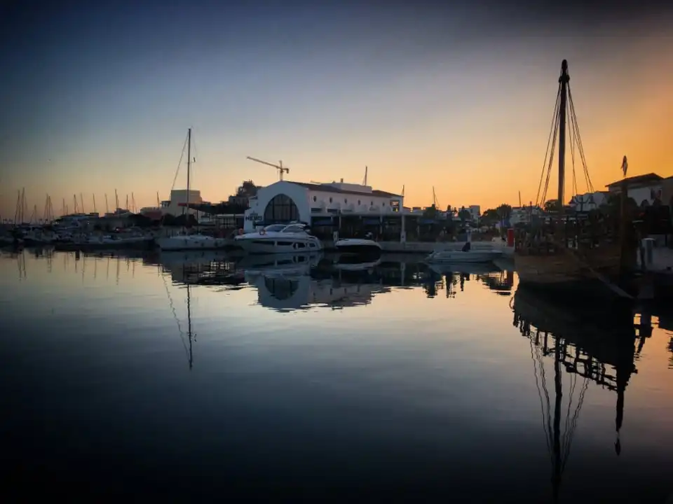 Boats and a dock at sunset
